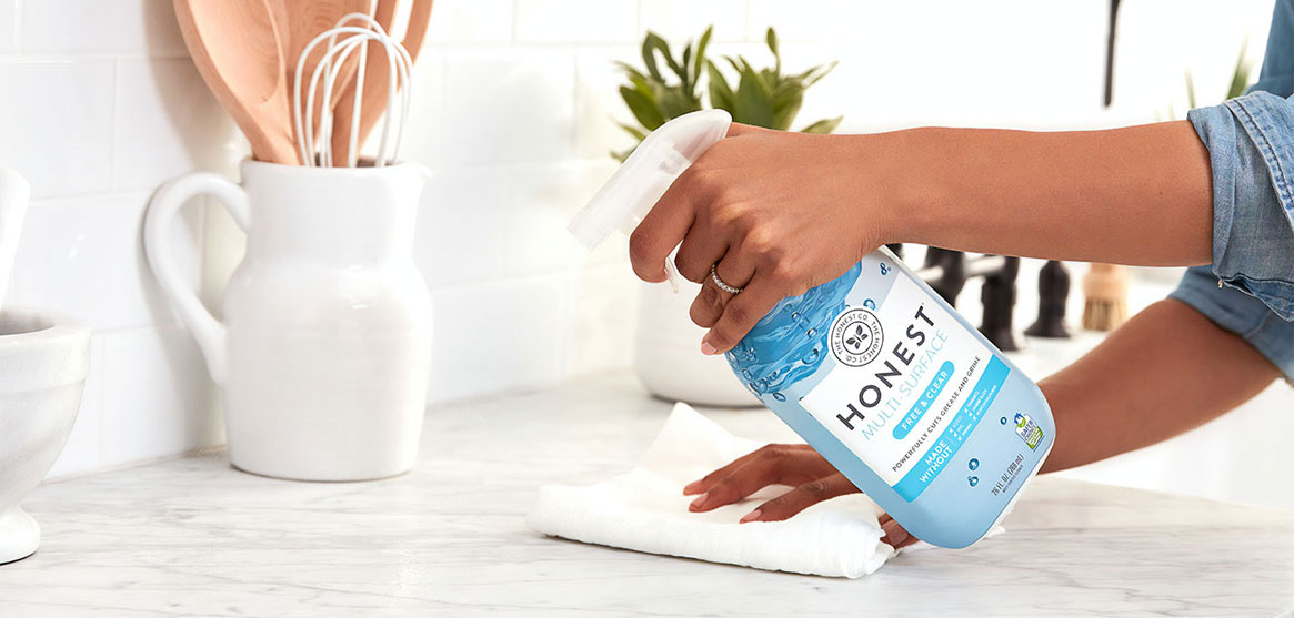 Person Cleaning Countertop Person Cleaning Countertop